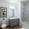 Bathroom with white cabinets and bathtub.